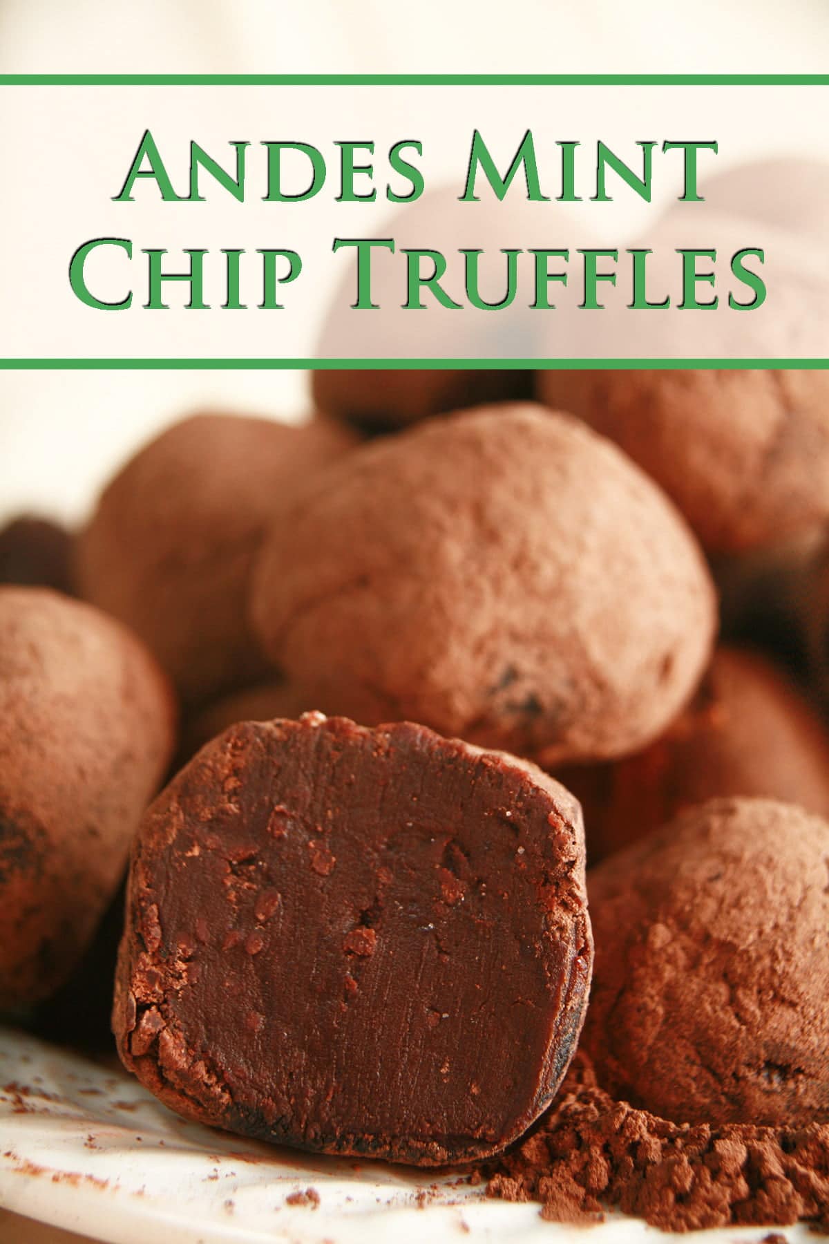 A small pile of Andes Mint Chip truffles rests atop a small mount of cocoa powder, on a small white plate.
