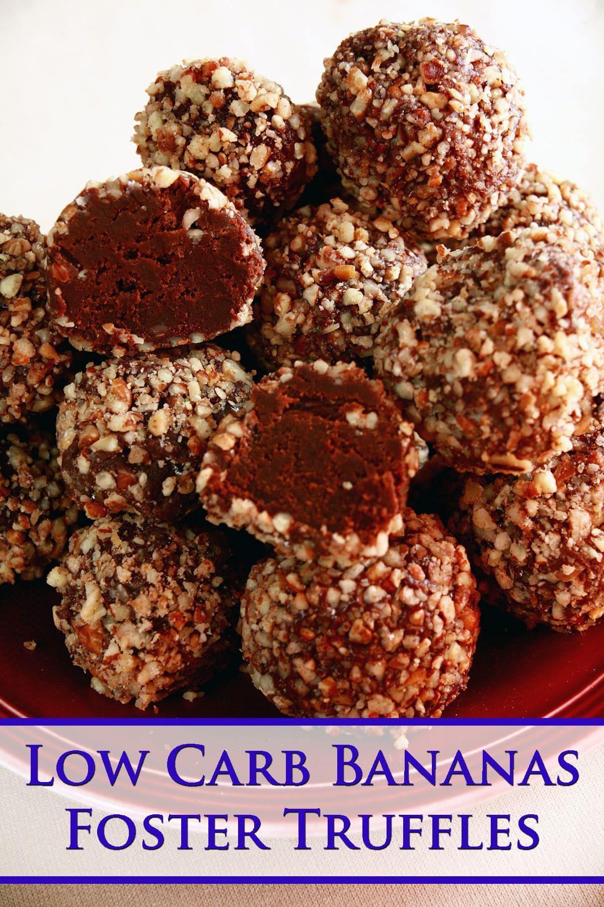 A close up view of a small plate piled with low carb bananas foster truffles. These are chocolate truffles coated in finely chopped pecans.