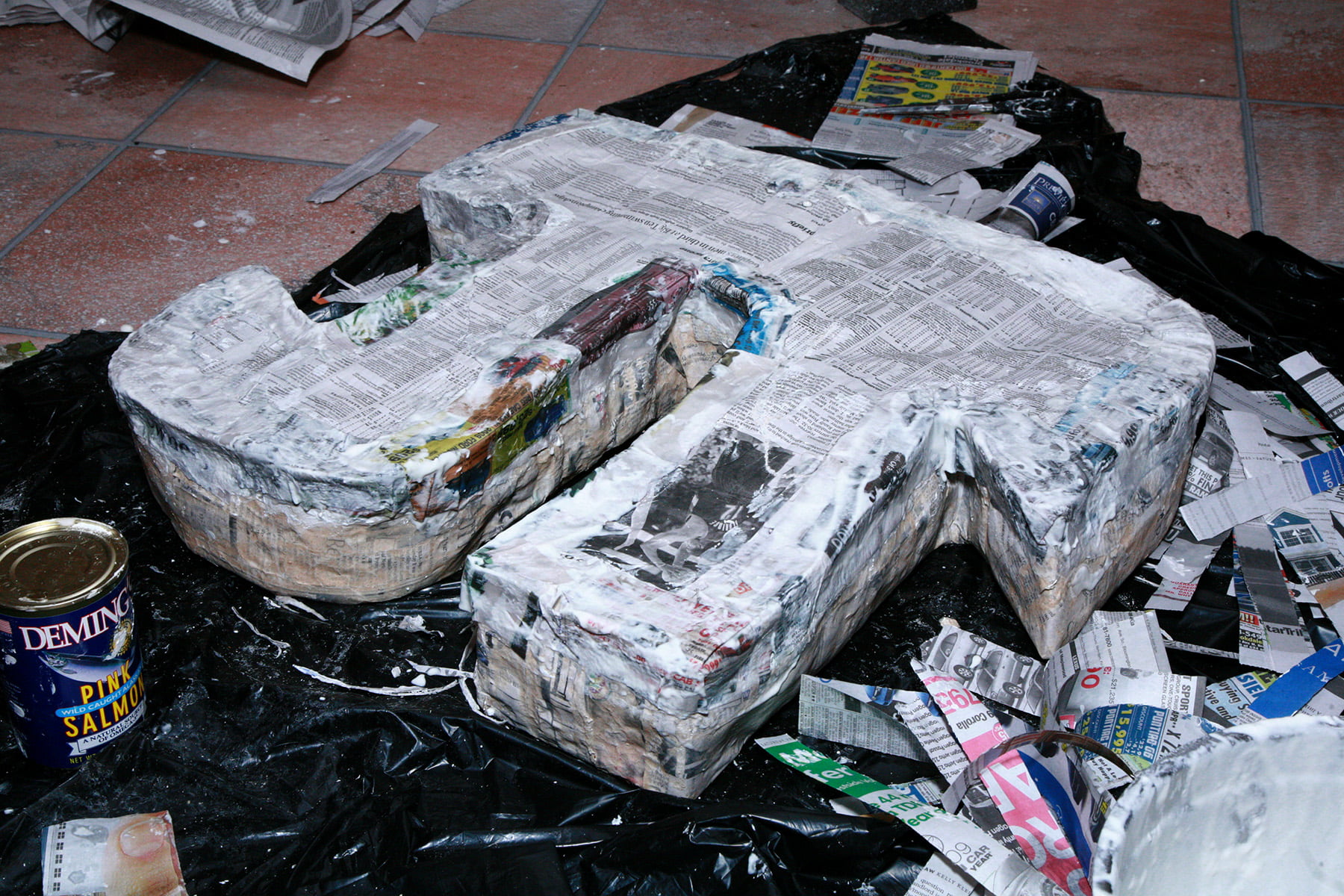 The paper machee pinata is shown with all edges sealed shut with more paper mache.
