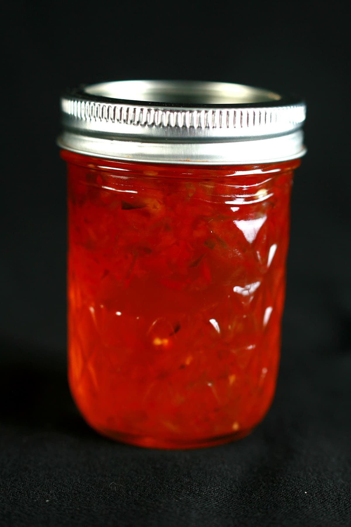 A jar of red pepper jelly.