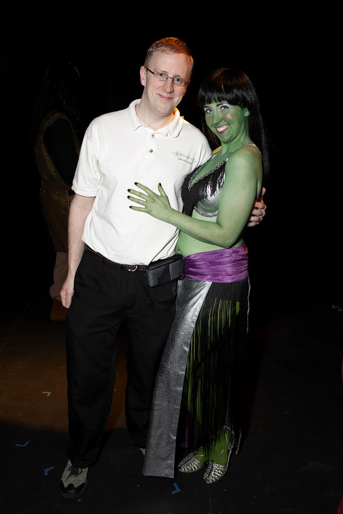 The author's husband poses with a green-skinned Orion Dancer.