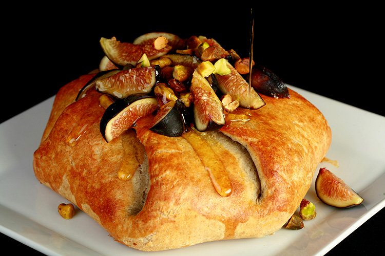 Brie en Croûte with Prosciutto, Honey Pear Sauce, and Figs