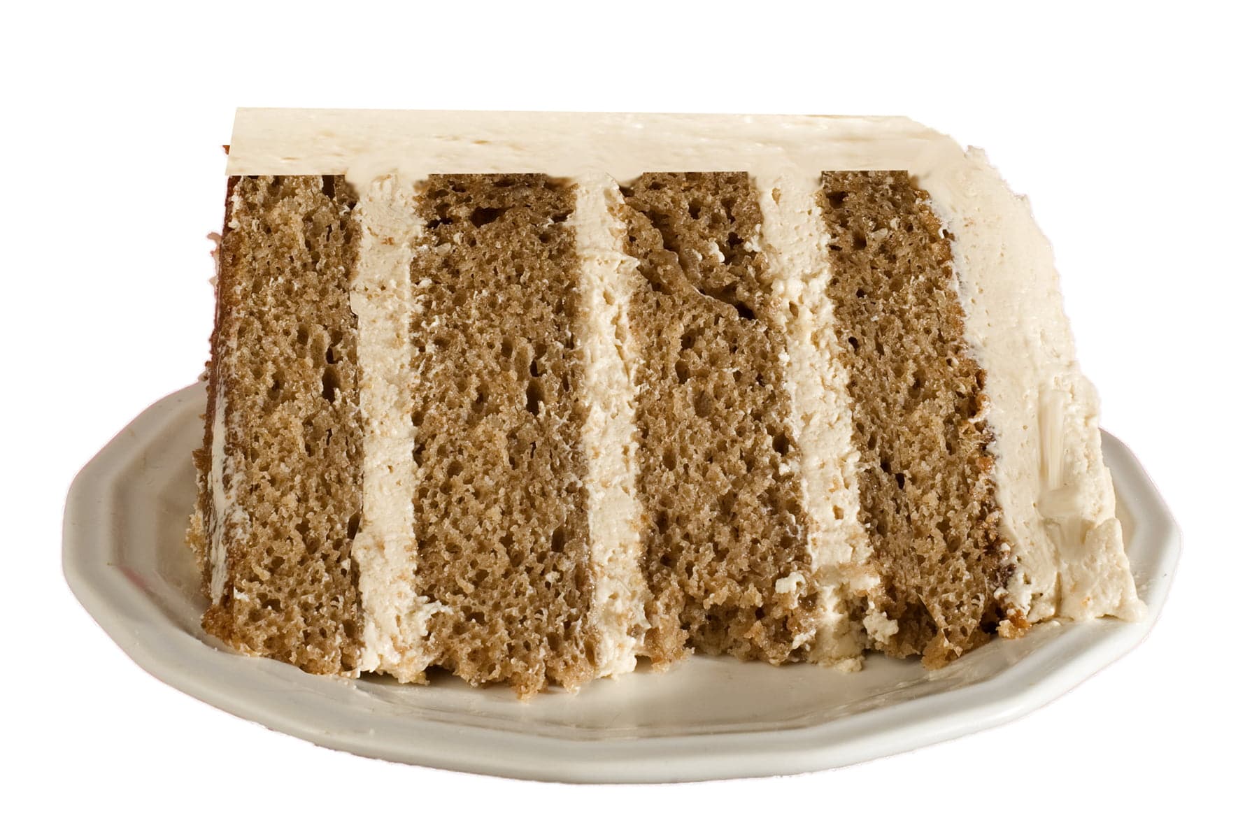 A slice of chai spice cake - a 4 layer spice cake with layers of chai buttercream.