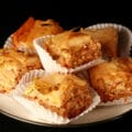 A small stack of squares of jalapeno beer peanut baklava, on a small plate.