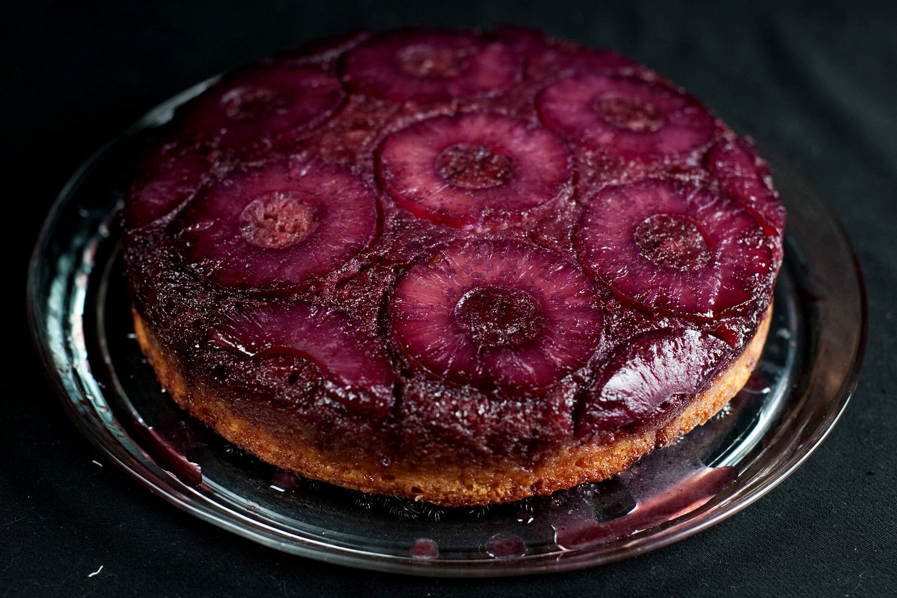 French Martini Upside Down Cake - A round pineapple upside down cake, with a VERY purple top.