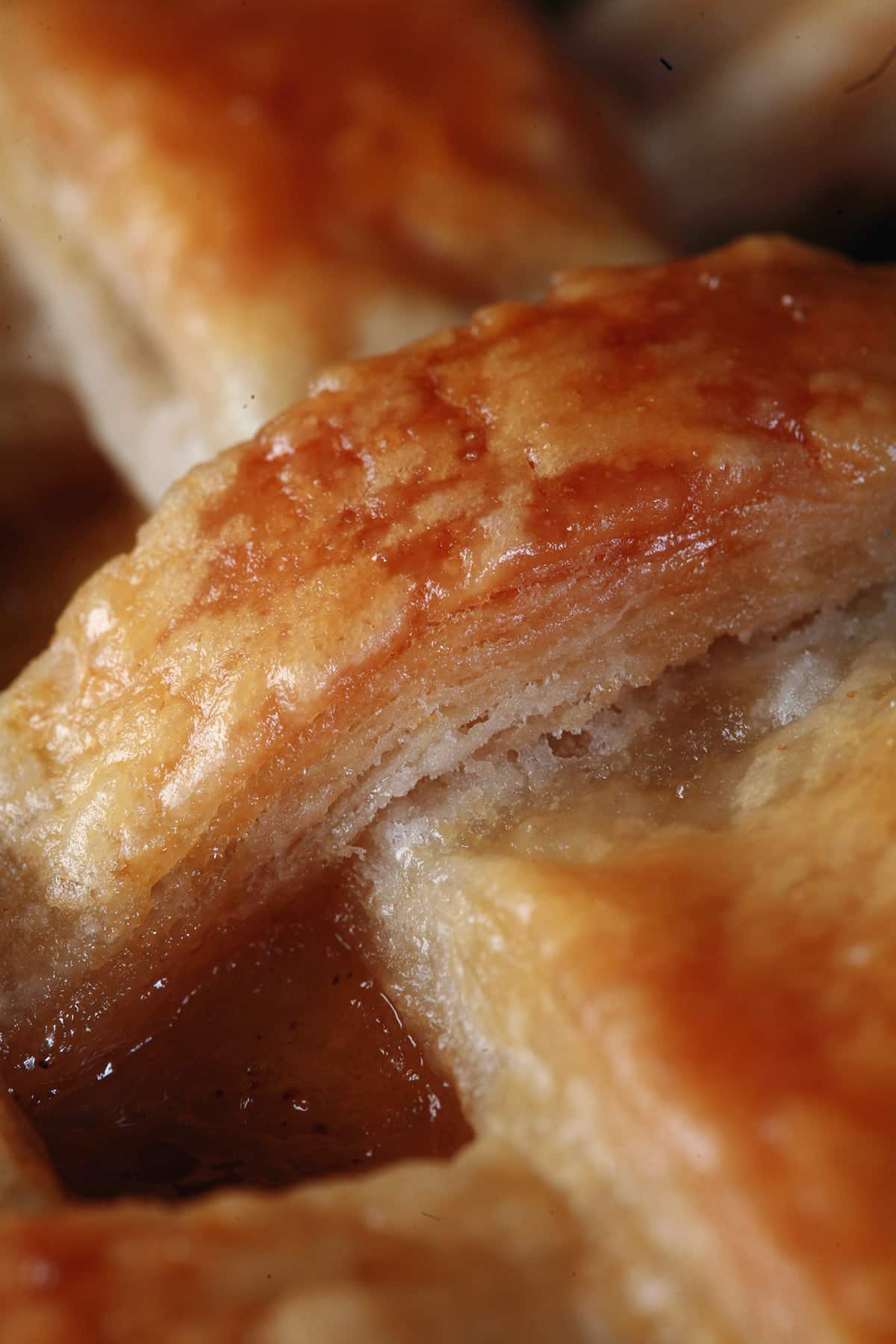 A close up view of a super flaky, perfect pie crust.
