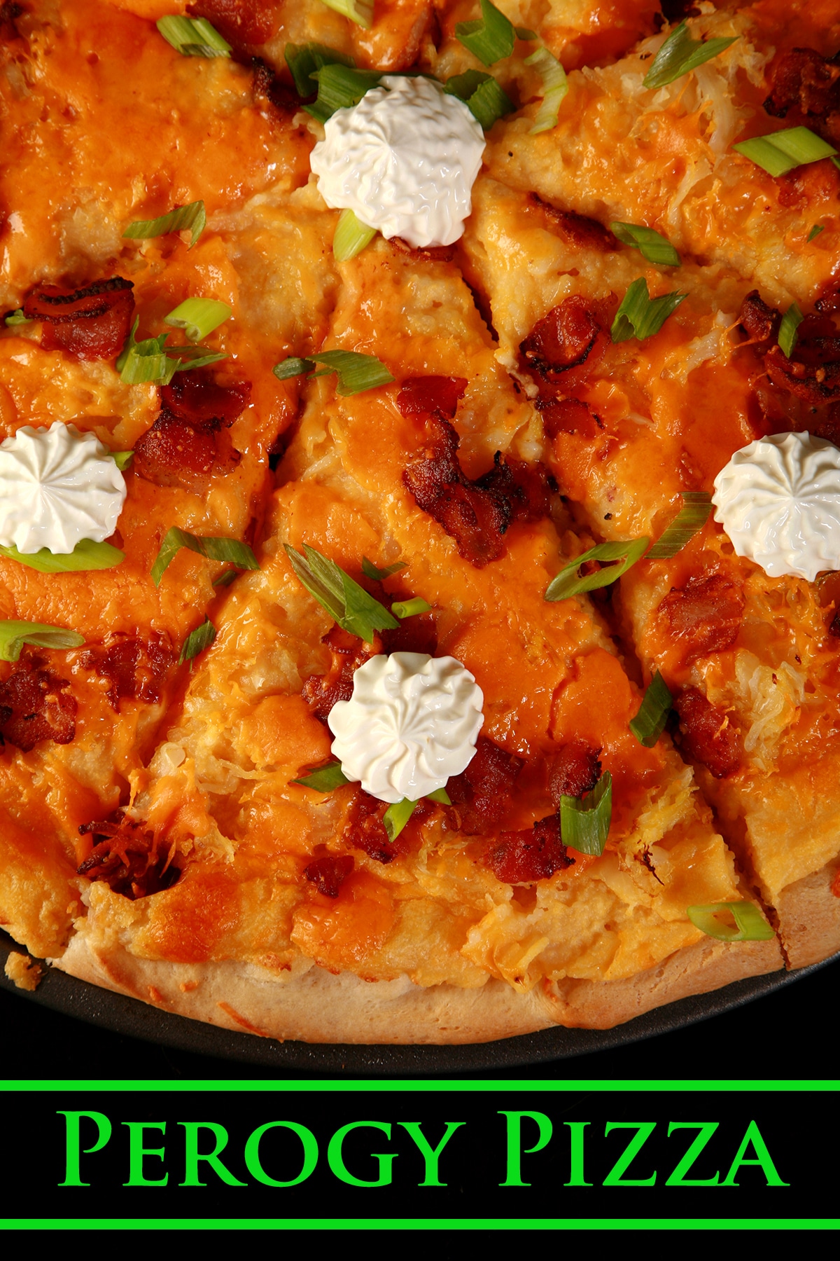 A whole Perogy Pizza - bacon, green onions, cheddar cheese, cheesy potatoes, and sour cream!