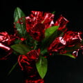 A bouquet made of mini liquor bottles. Each is wrapped in red mylar to look like a rose.
