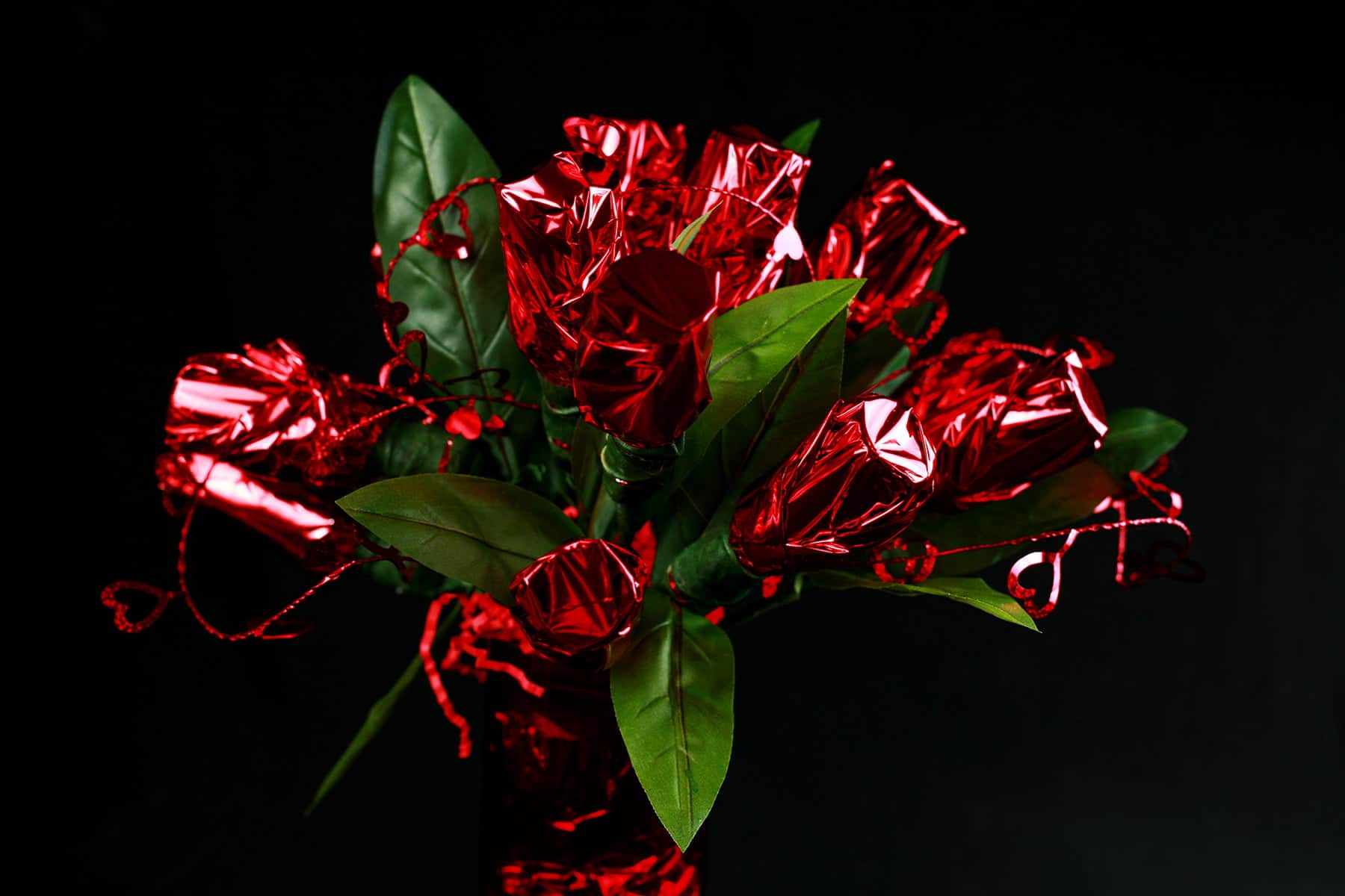 A bouquet made of mini liquor bottles.  Each is wrapped in red mylar to look like a rose.