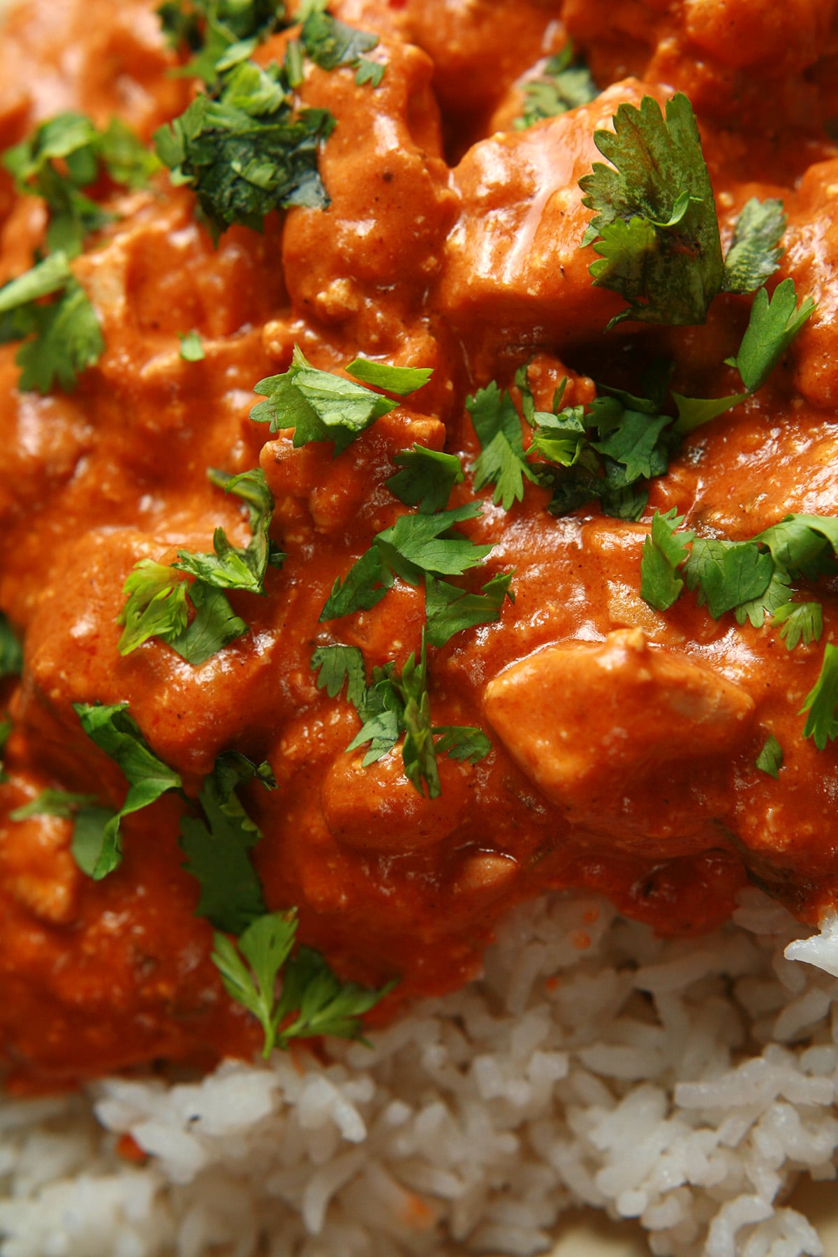 A close up view of Butter Chicken - Chicken in a  creamy tomato sauce.