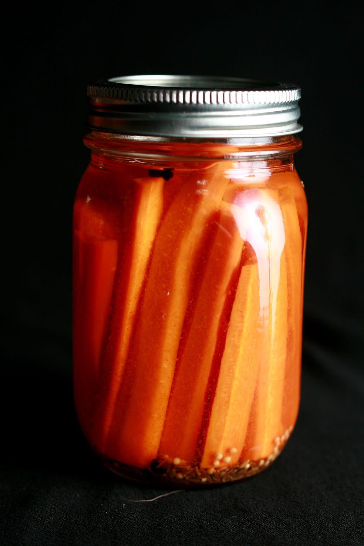 A jar of homemade pickled carrots.