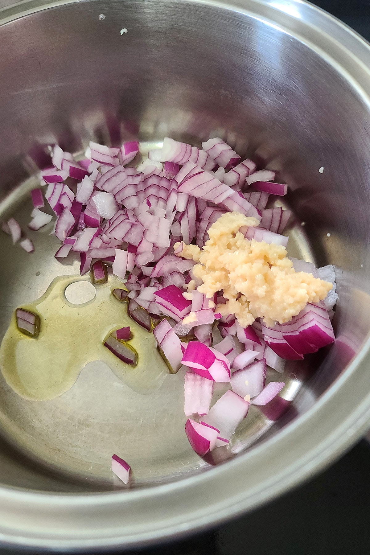 Chopped onion and garlic in a pot with some olive oil.