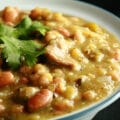 A close up view of a bowl of roasted green chili.