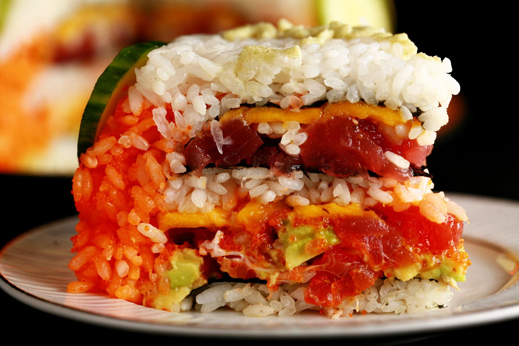 A small sushi cake. Layers of rice and fish in the form of a birthday cake.