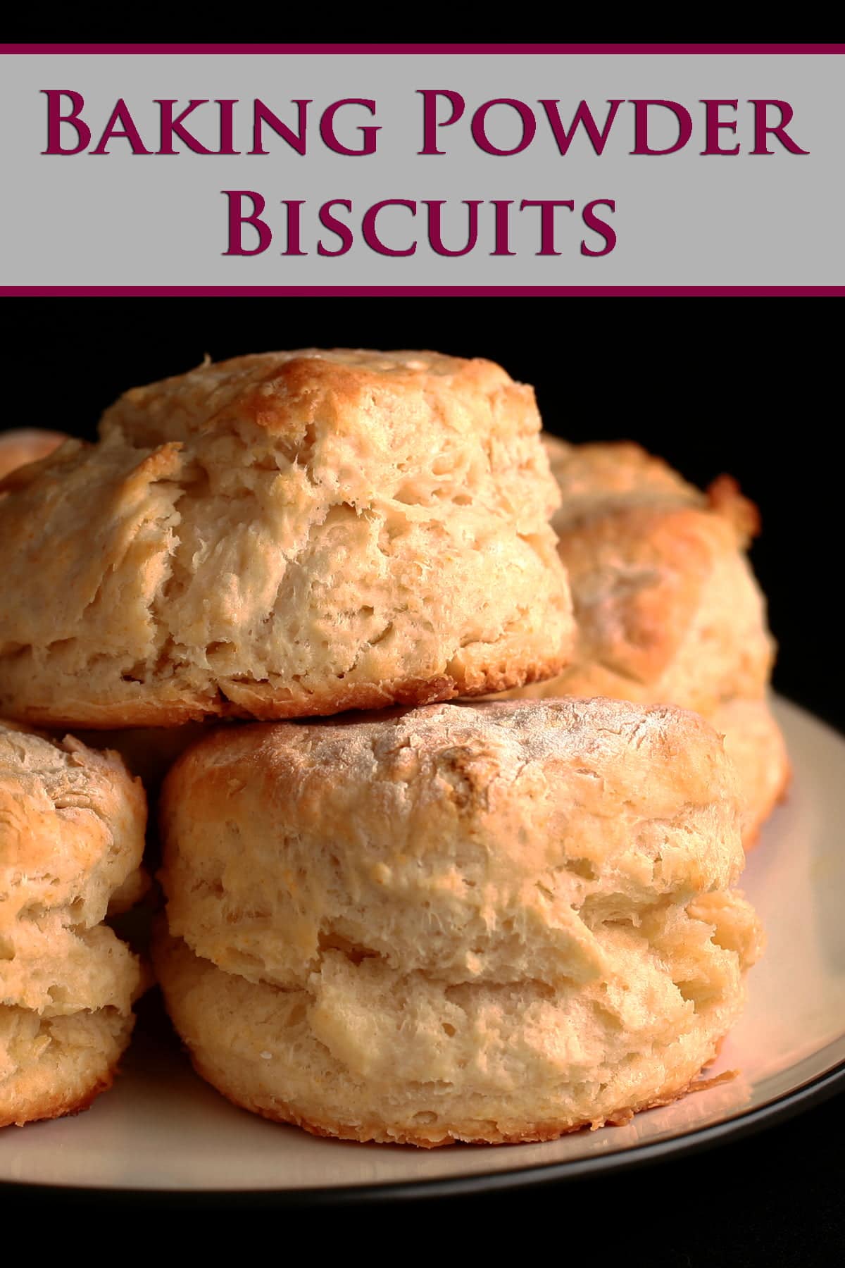 A small plate, stacked with golden baking powder biscuits.