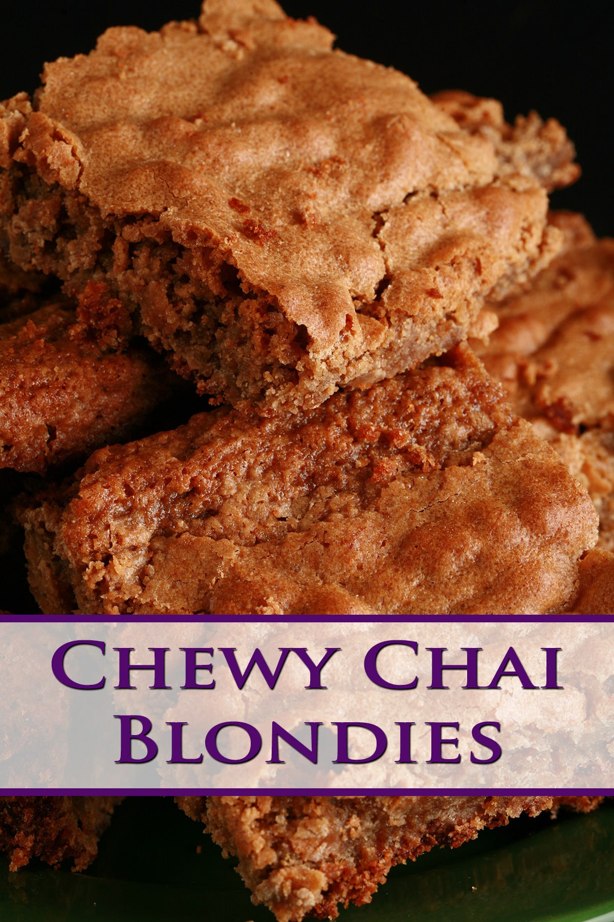 Several chewy chai blondies stacked on a small green plate.