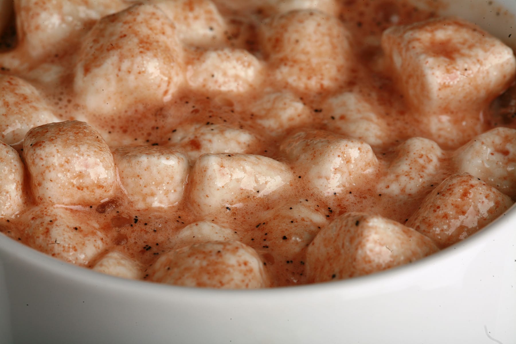 A close up view of a mug of grown up boozy hot chocolate.