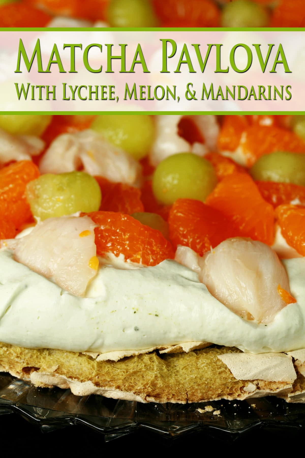 A Matcha Pavlova with Mandarin orange segments, lychee, and honeydew melon on top.