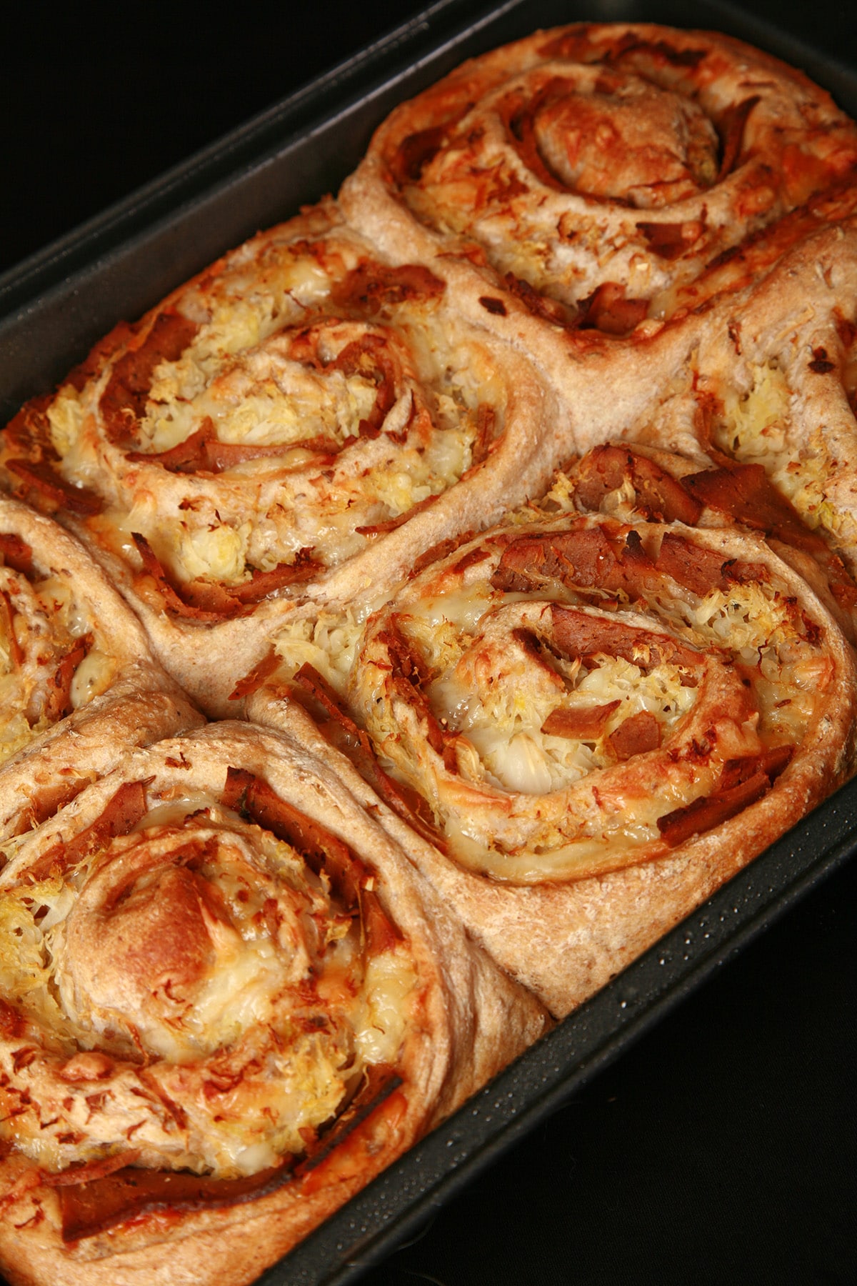 A pan of 6 Reuben buns.