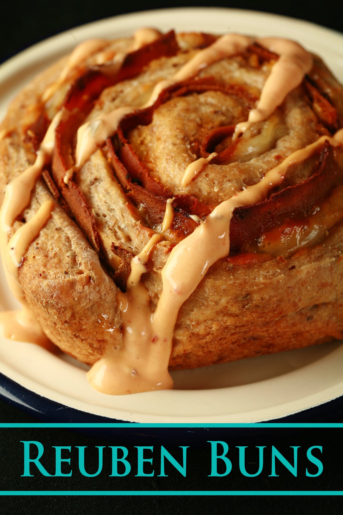 A large Reuben bun, drizzled with Thousand Island dressing.