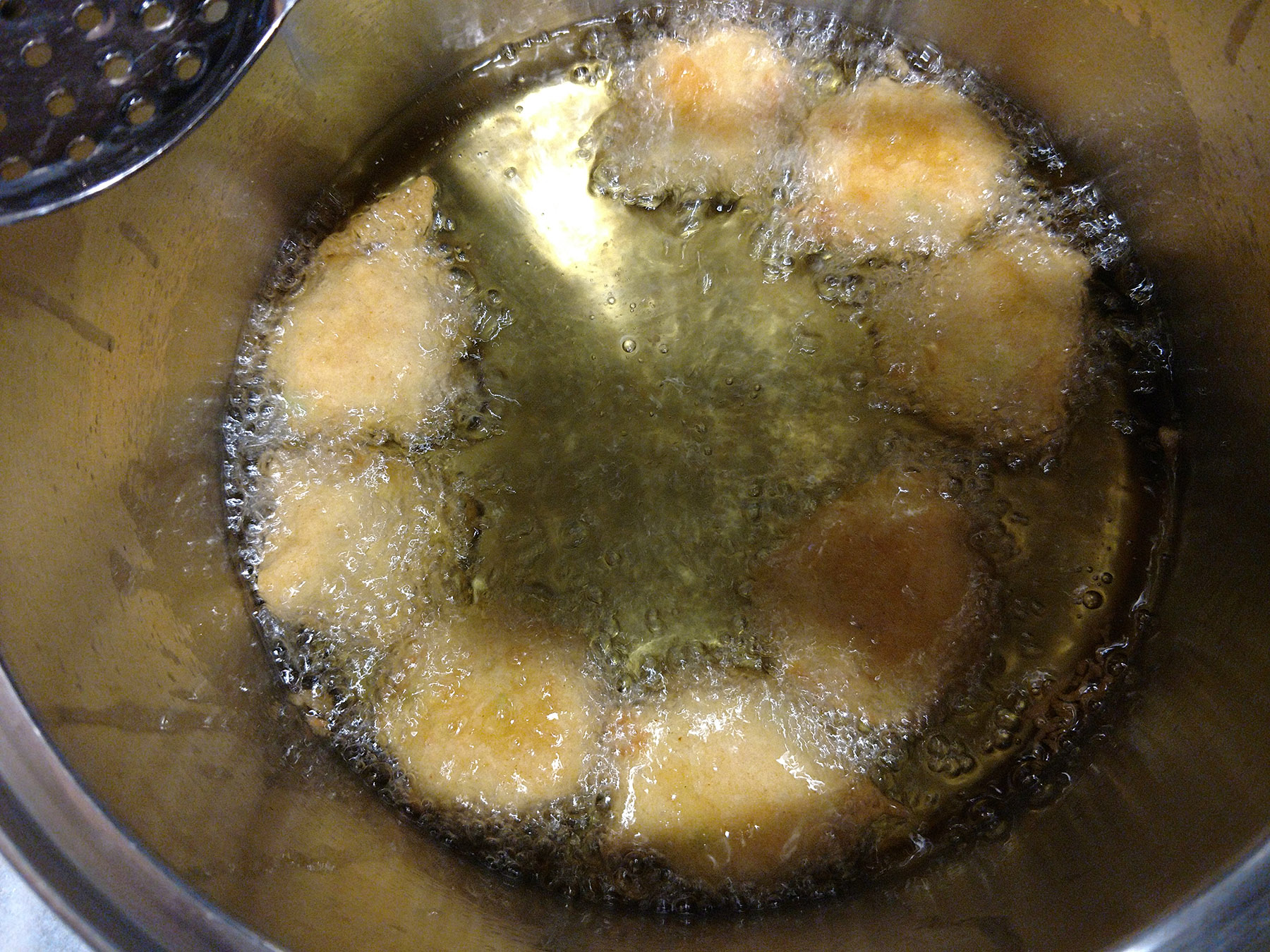 Gluten-Free Trader Joe's Tofu Edamame Nuggets, deep frying in a large pot.