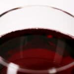 Close up view of a glass of red wine.