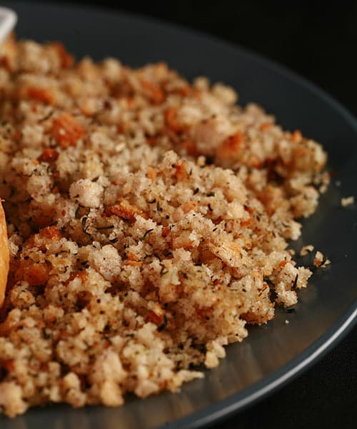 Close up photo of a plate of dressing - seasoned and buttered bread crumbs.