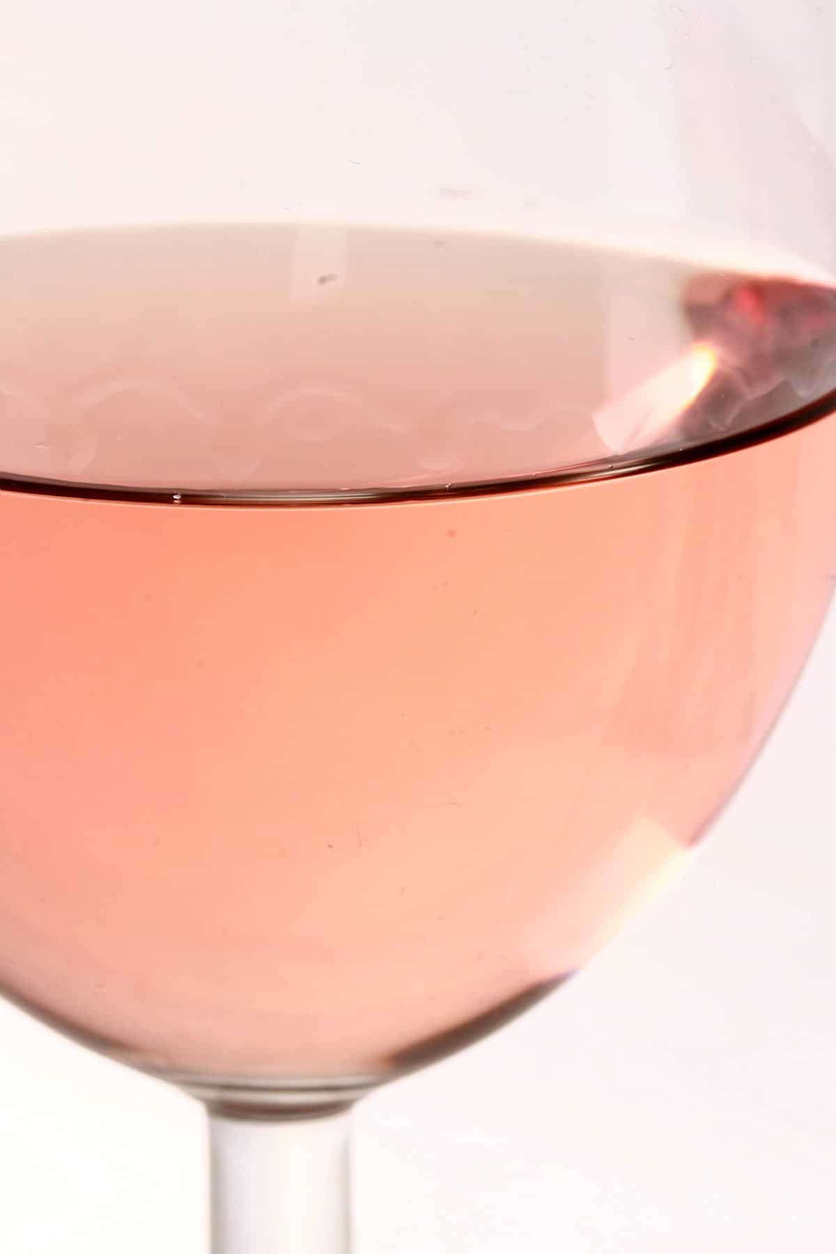 Close up view of a glass of Rose wine.