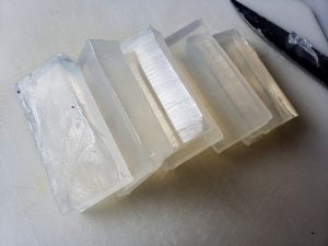 Close up photo of a sliced brick of clear glycerin soap.