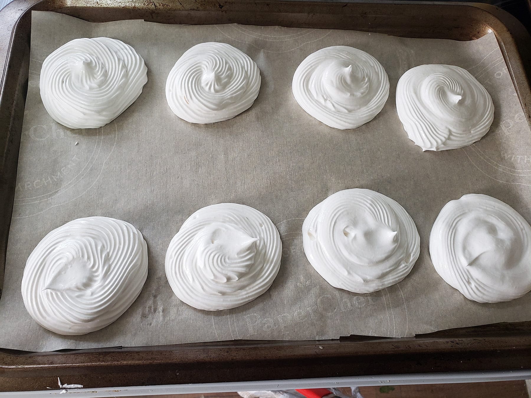 8 small meringues, piped onto a parchment lined baking sheet.