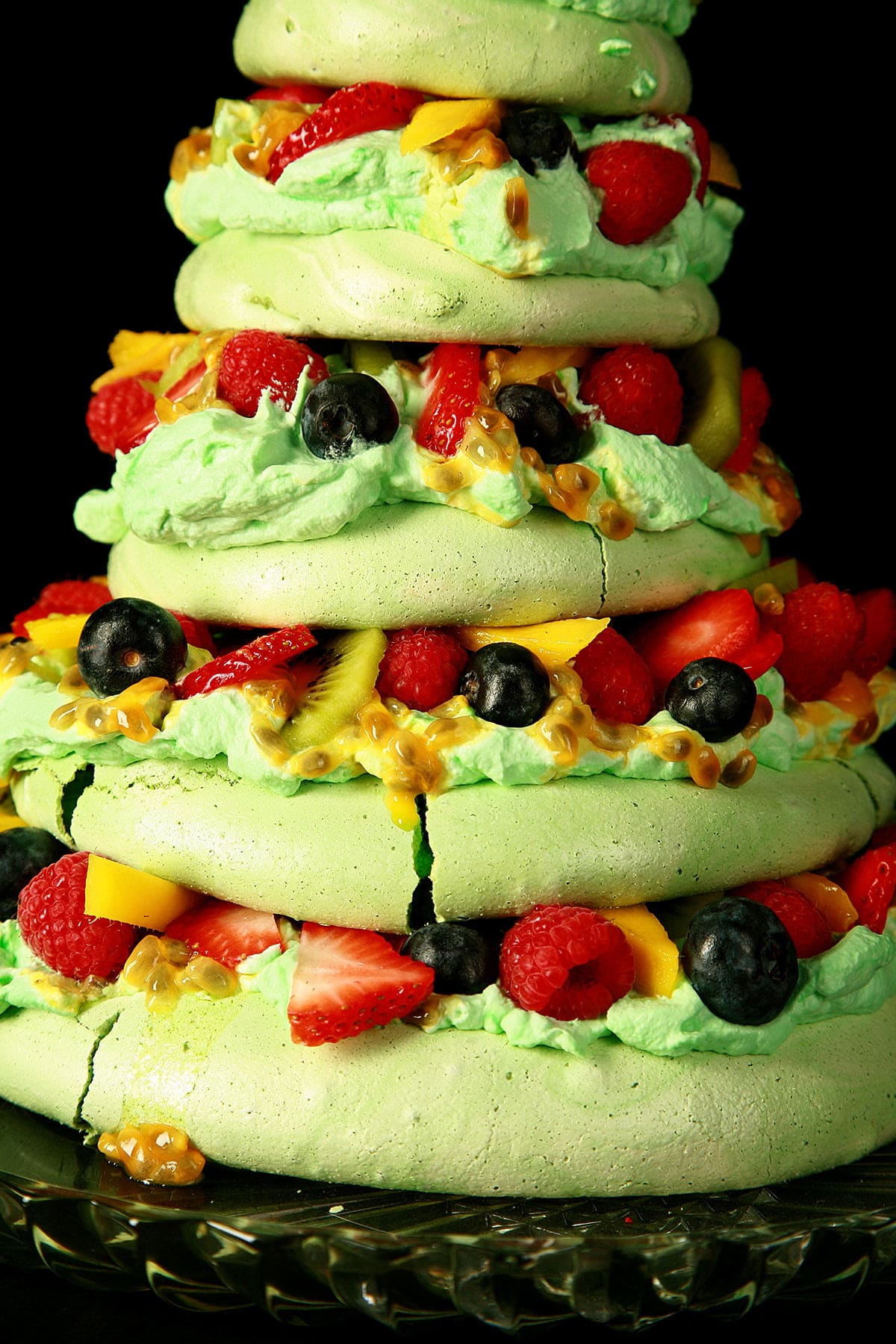 Side view of a 5 tier Pavlova, styled to look like a Christmas Tree.