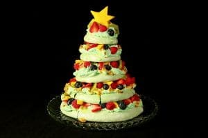A 5 tier Christmas Tree Pavlova, topped with a star shaped slice of mango