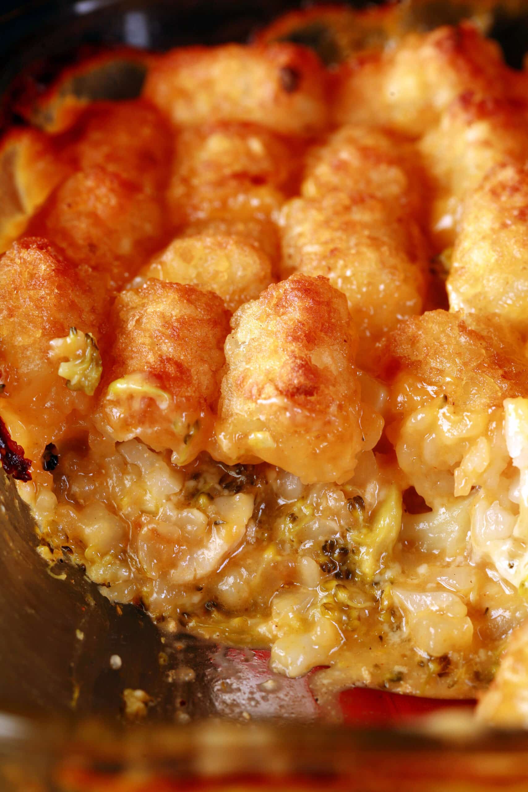 A pan of cheesy chicken and broccoli tater tot casserole.