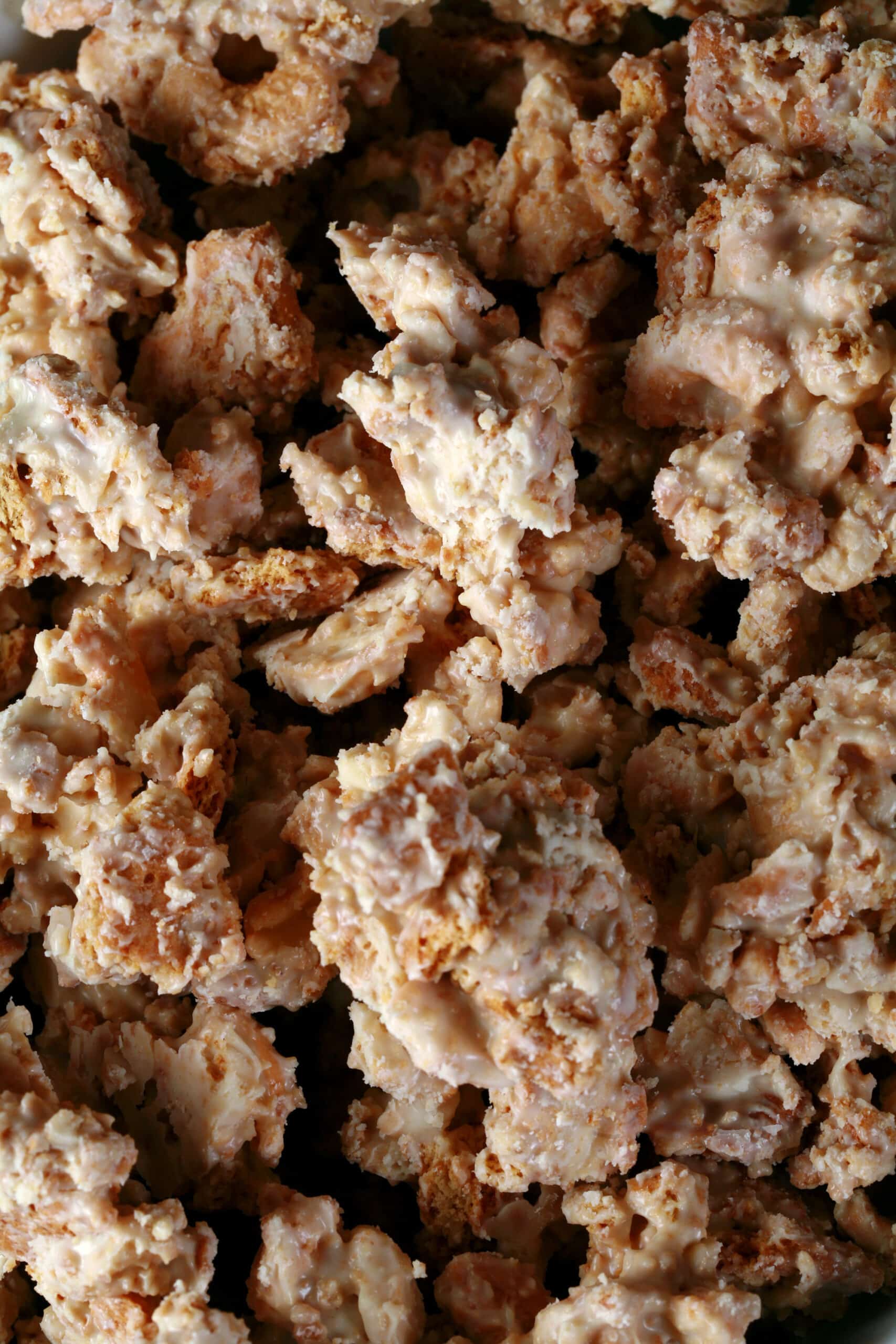 A bowl of homemade clodhoppers: clusters of cashew pieces, graham crackers, and white chocolate.