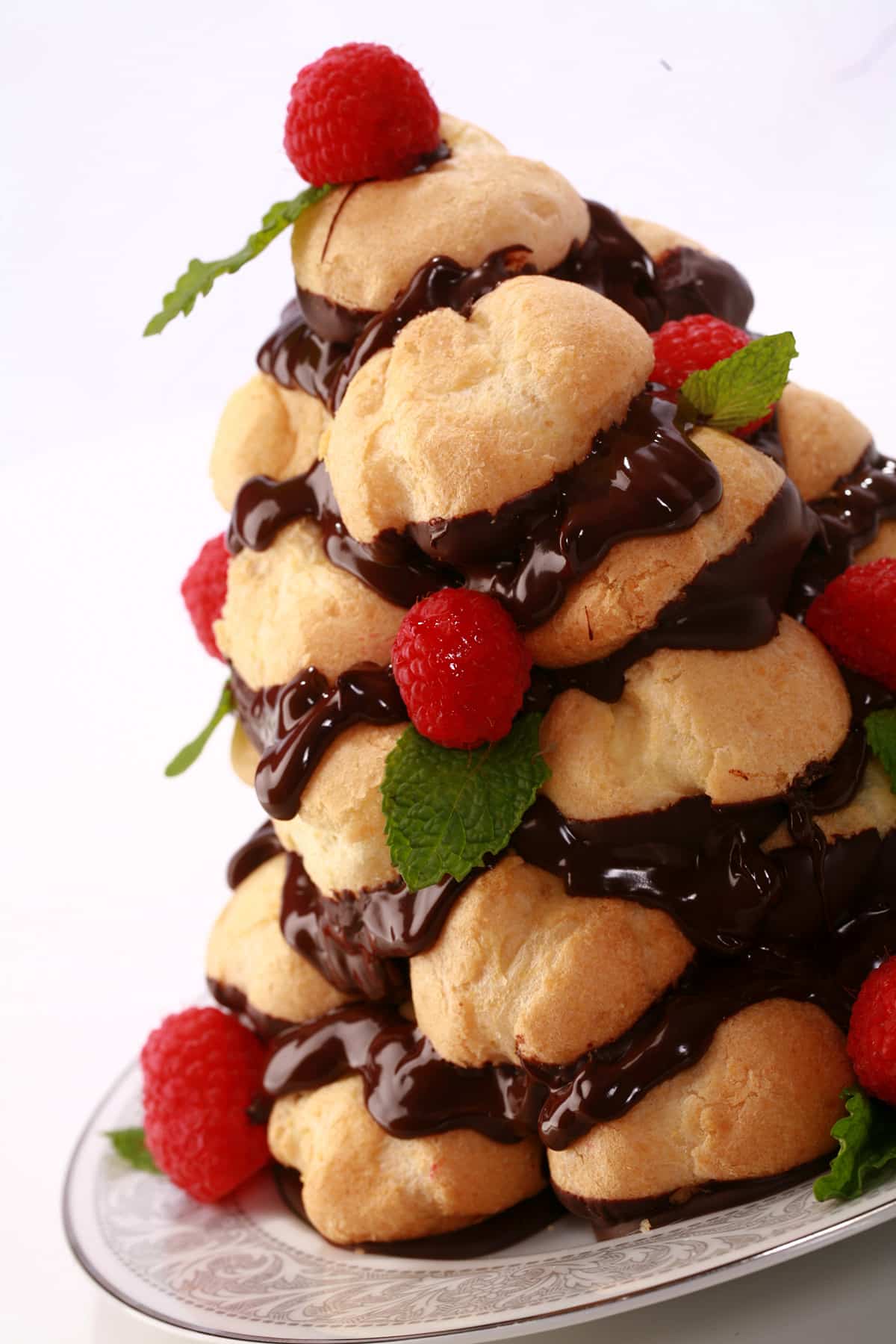 A mini chocolate croquembouche with raspberries and mint.