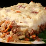 A close up photo of a serving of shepherd's pie.