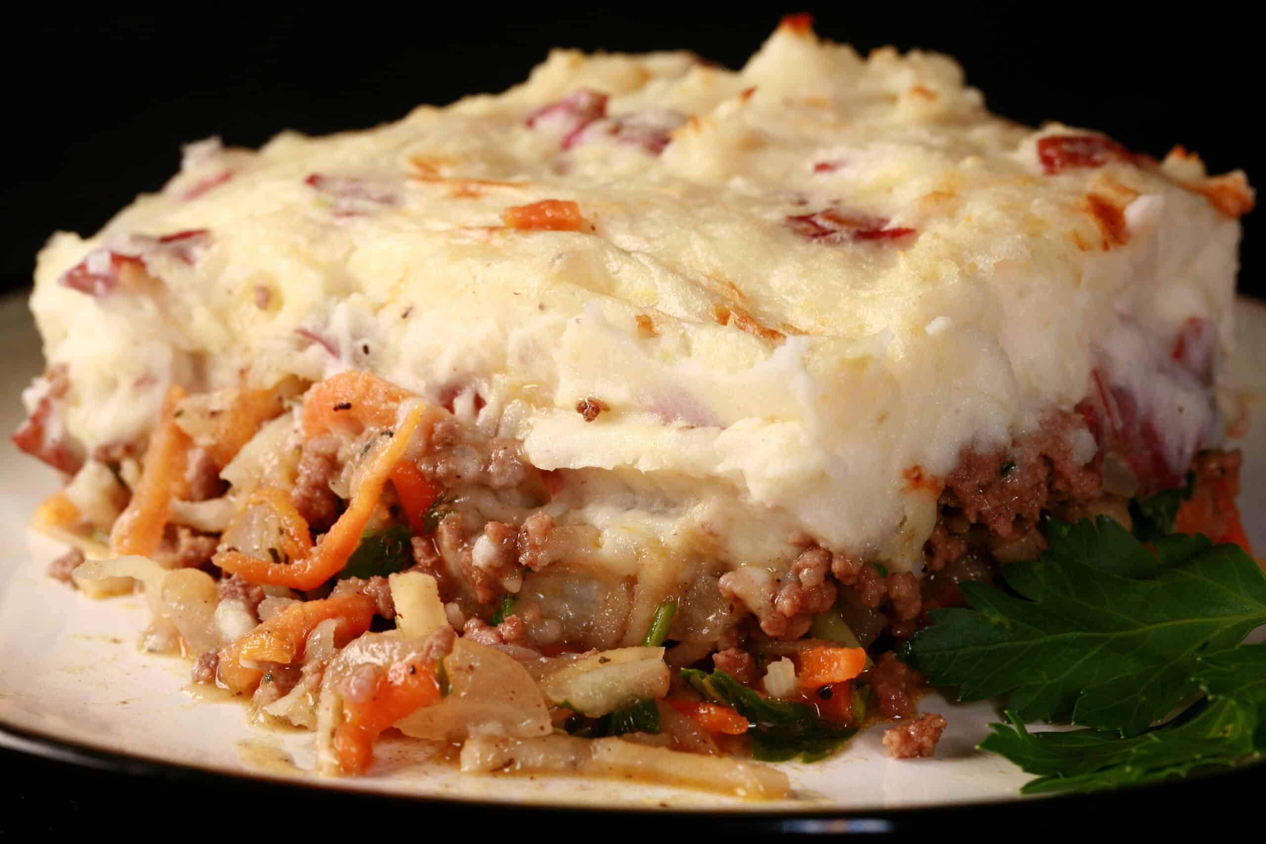 A close up photo of a serving of shepherd’s pie.