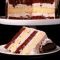 A whole cookies n creme torte, with a slice of layered cookies and cream cake in front of it.