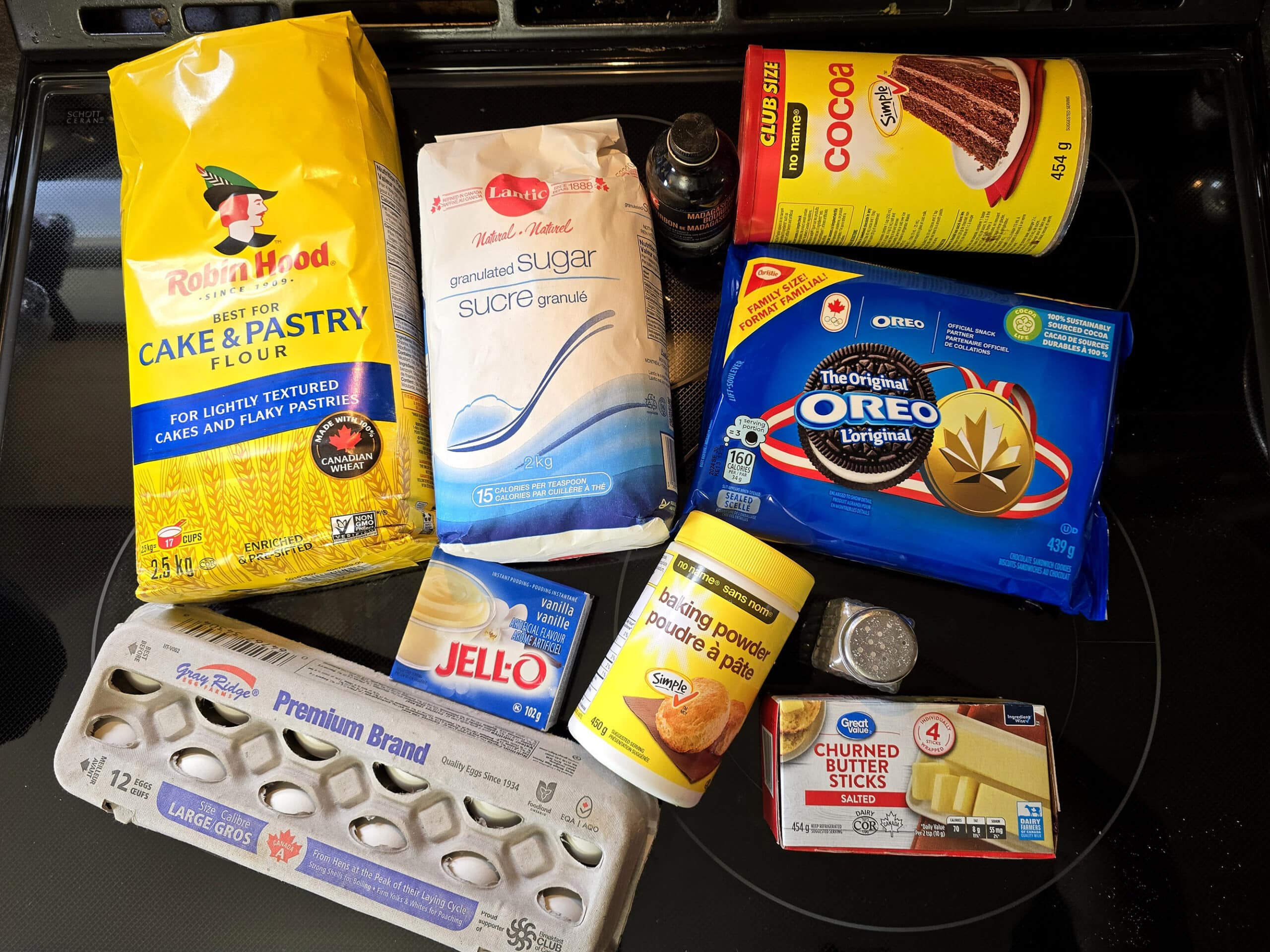 All of the ingredients for my cookies and cream cake laid out on a stovetop.