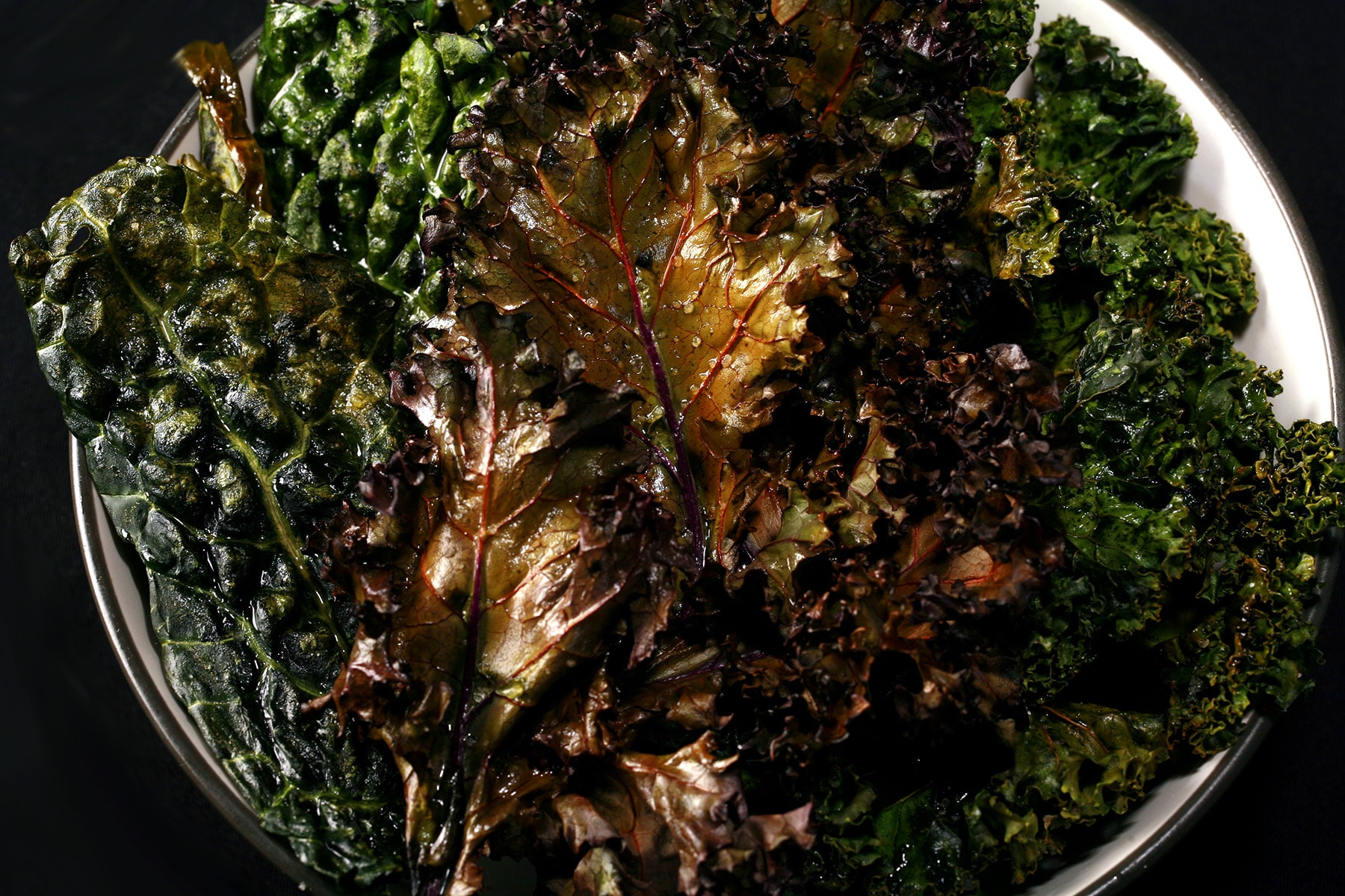 A bowl of chips made from various varieties of kale.