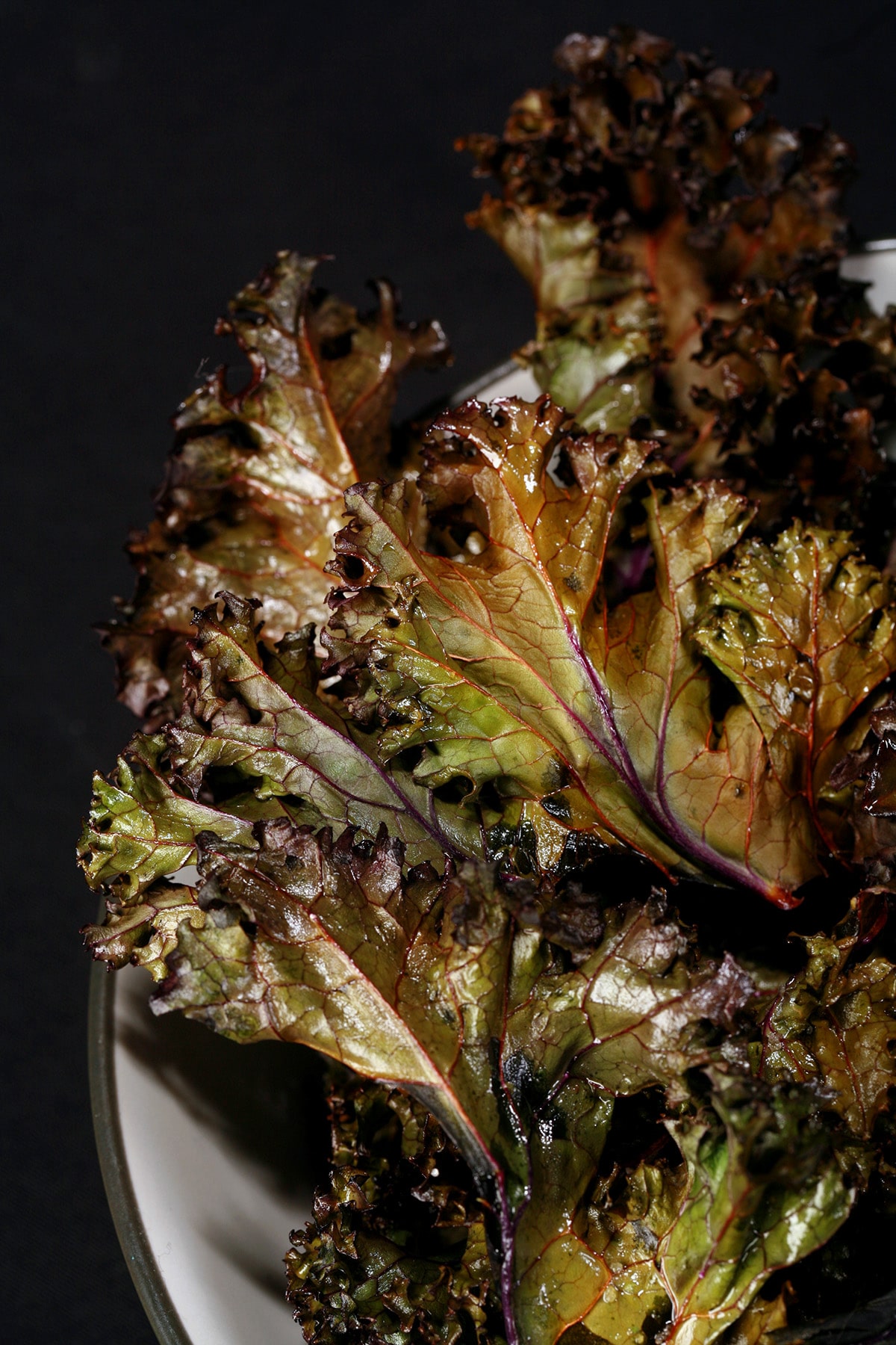 A bowl of red kale chips.