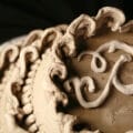 A close up view of Lambeth style cake piping, made in cement.