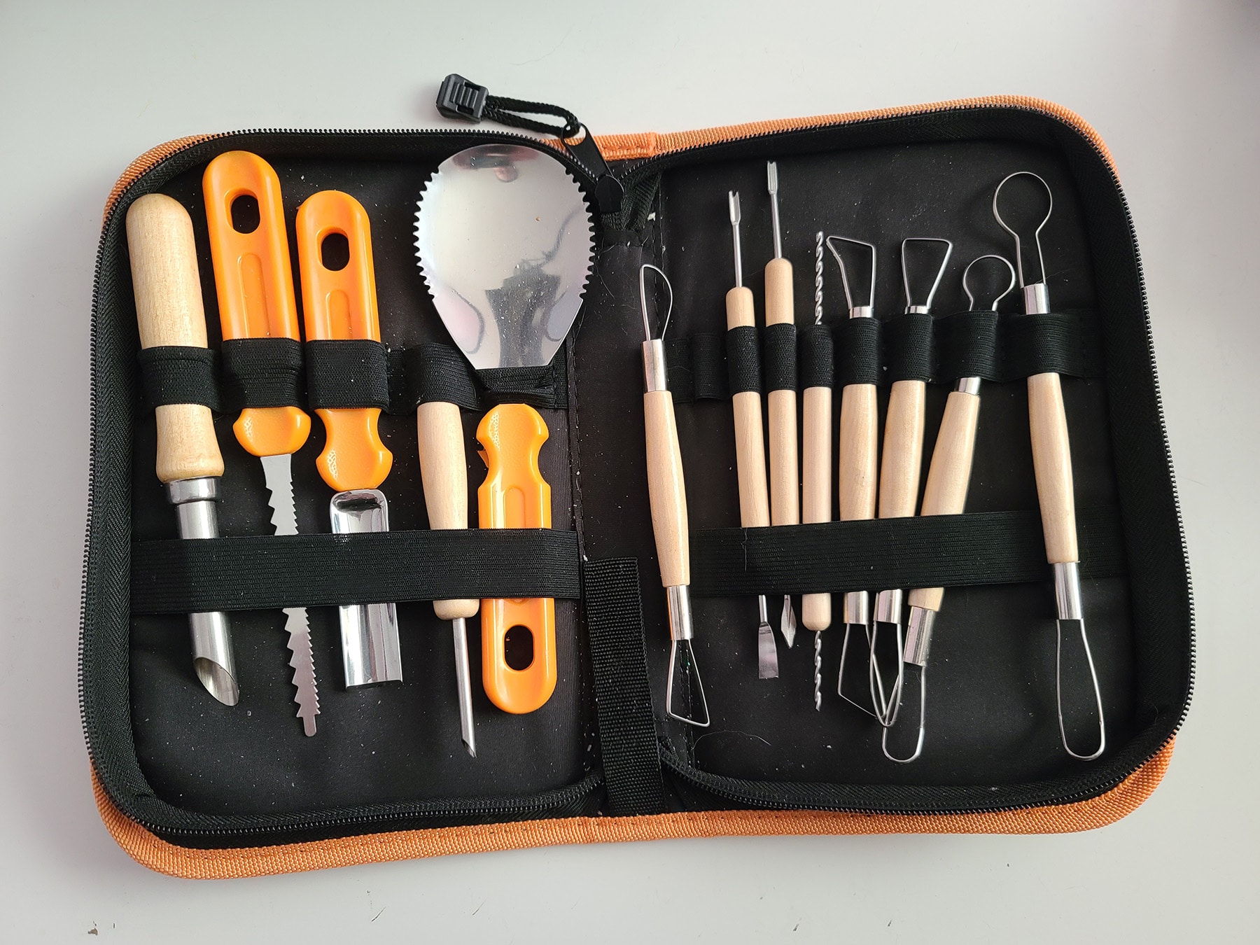 A set of pumpkin carving tools, in a zippered case.