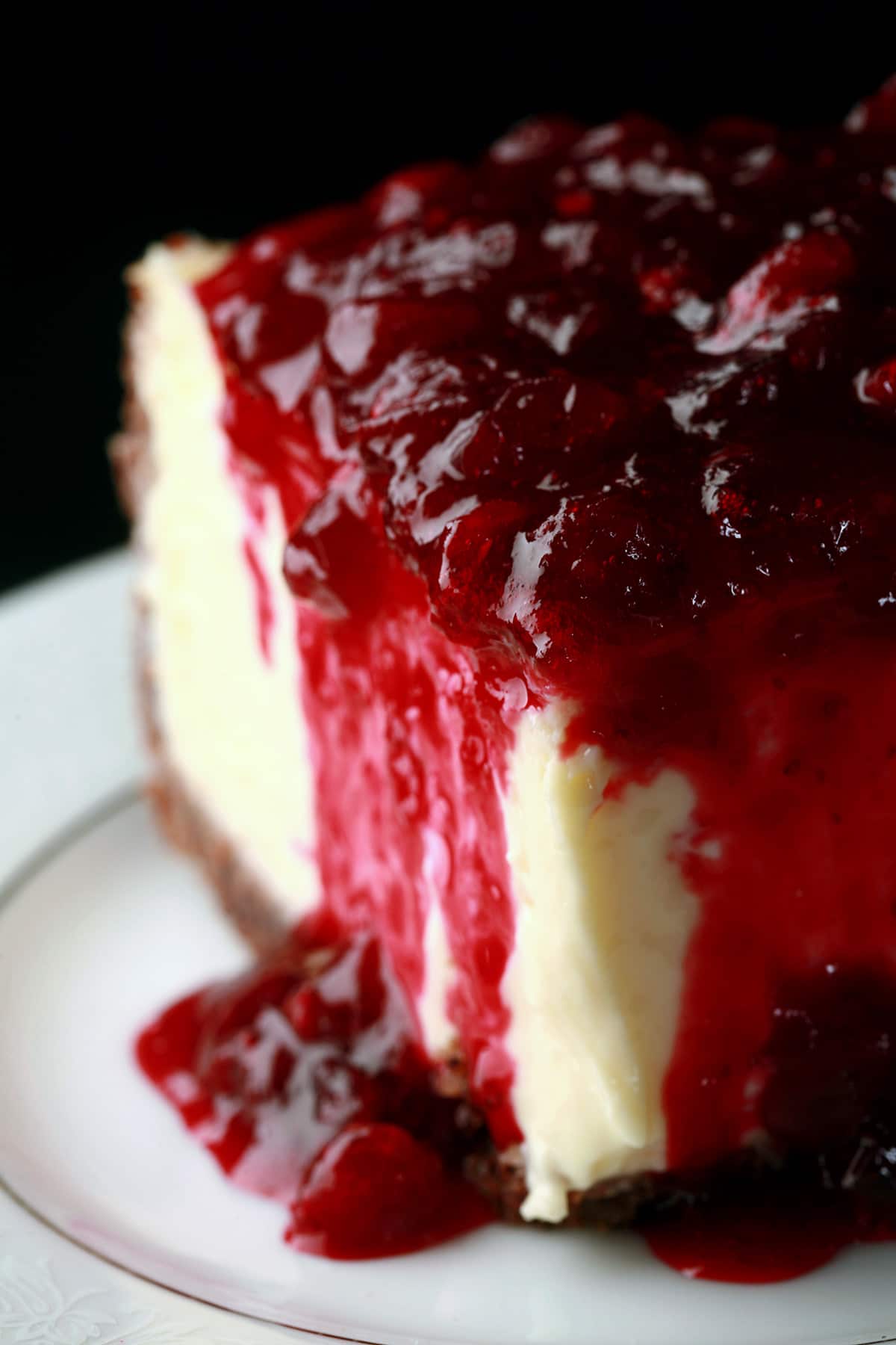 A close up view of a slice of partridgeberry cheesecake.