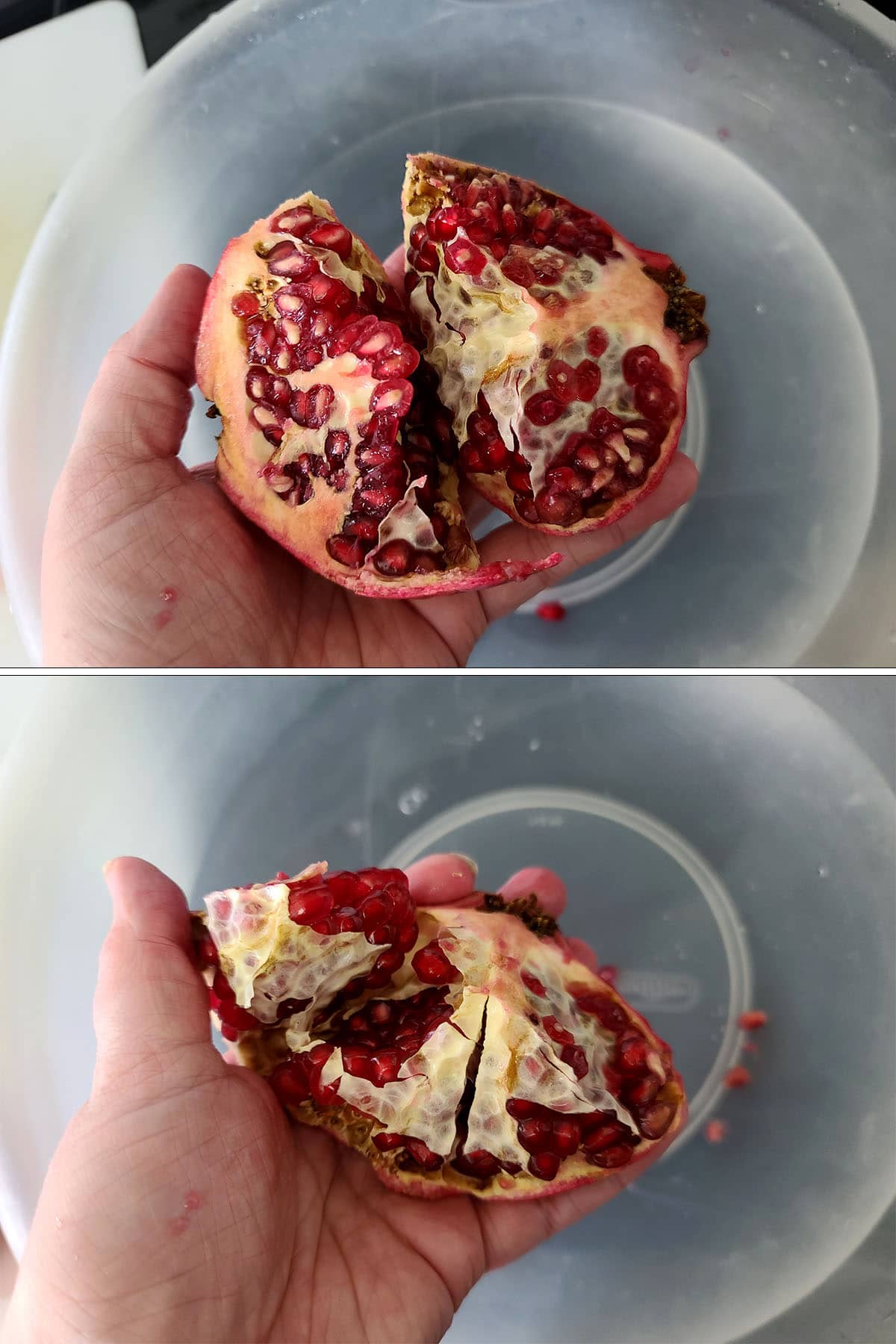 A hand holds a chunk of pomegranate over a bowl of water.