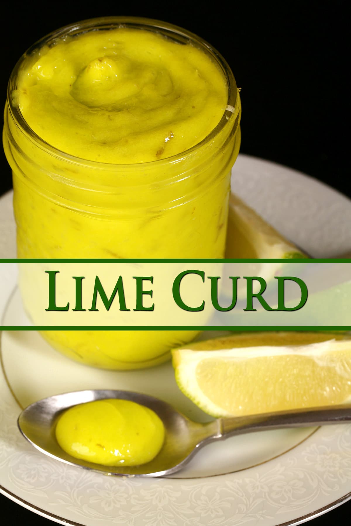 A jam jar of lime curd on a plate with fresh lime slices.