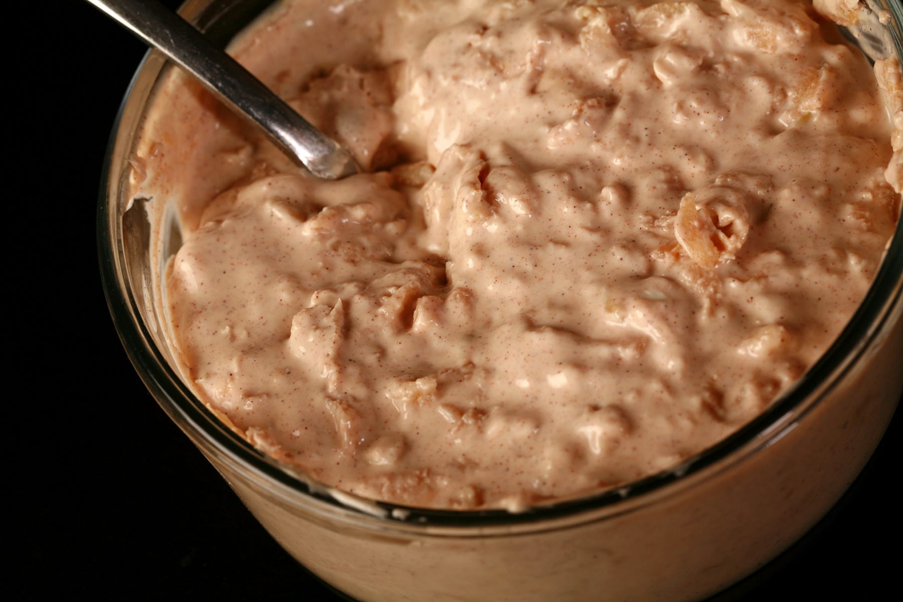 A glass dish of homemade spiced apple cream cheese.