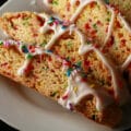 Several birthday cake biscotti on a plate.