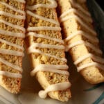 Several lemon poppyseed biscotti on a plate.