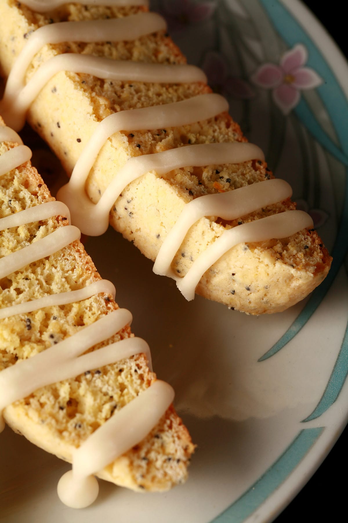 Several lemon poppyseed biscotti on a plate.